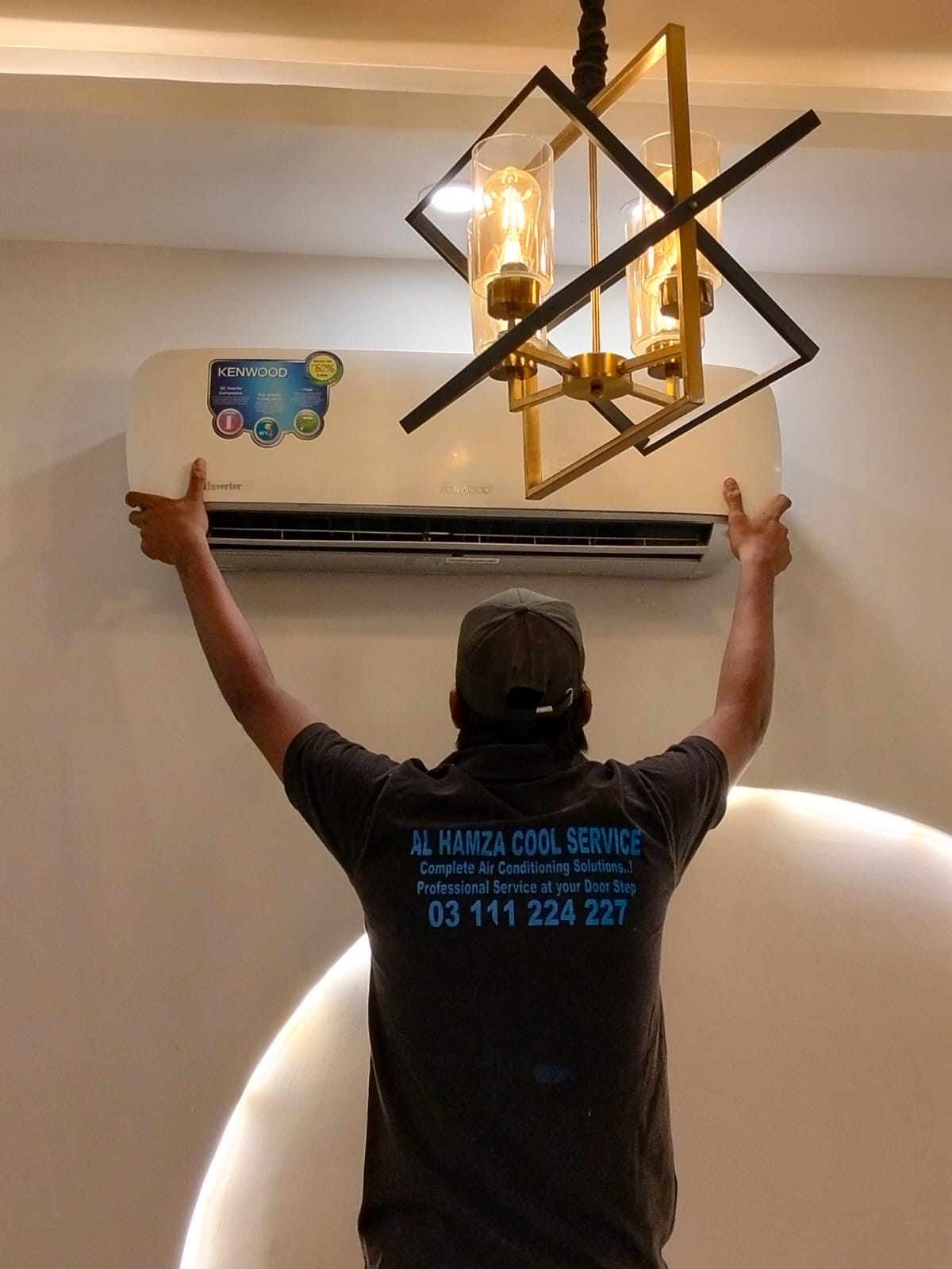 Technician servicing an outdoor air conditioning unit